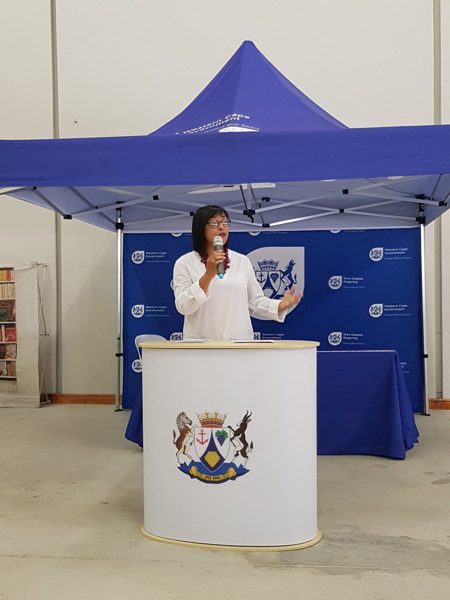 SABookFair's tweet photo. Rene Arendse sharing a motivational message at the launch of #SAlibraryWeek in Caledon. She's posing the question, how will you use your library to bring about change? 🇿🇦
#CollaborateAtYourLibrary
@NLSA1 @LIASANews @WesternCapeGov https://t.co/1uJORescyr