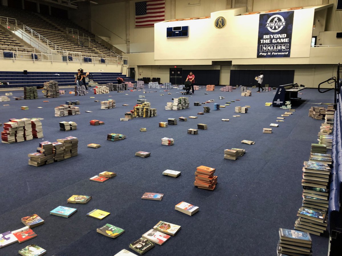 NISD's tweet photo. #ThisIsNorthside- 40,000 free books will be distributed this Saturday to students &amp; staff at 48 Title 1 schools. But first, the books have to be unloaded and sorted by volunteers at Paul Taylor Field House! https://t.co/SwsVNOHyOG