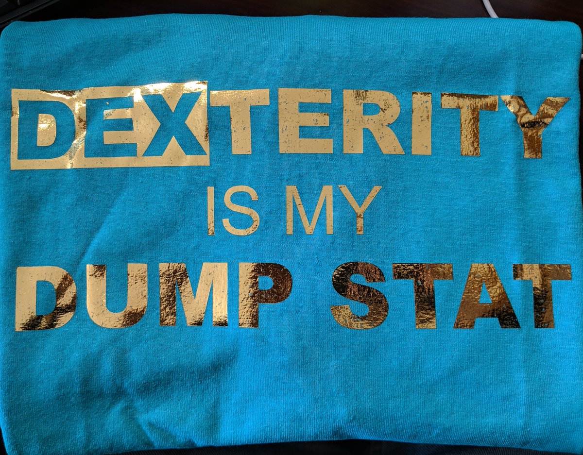 Humansimulator's tweet photo. My dexterity dump stat tee from @DumpStatTees arrived today. Look at that glorious gold foil. Can't wait to wear it tomorrow for my D&amp;D session.

#whatisyourdumpstat #dumpstattees #clevercowdesigns https://t.co/C7eZ6fwSFu