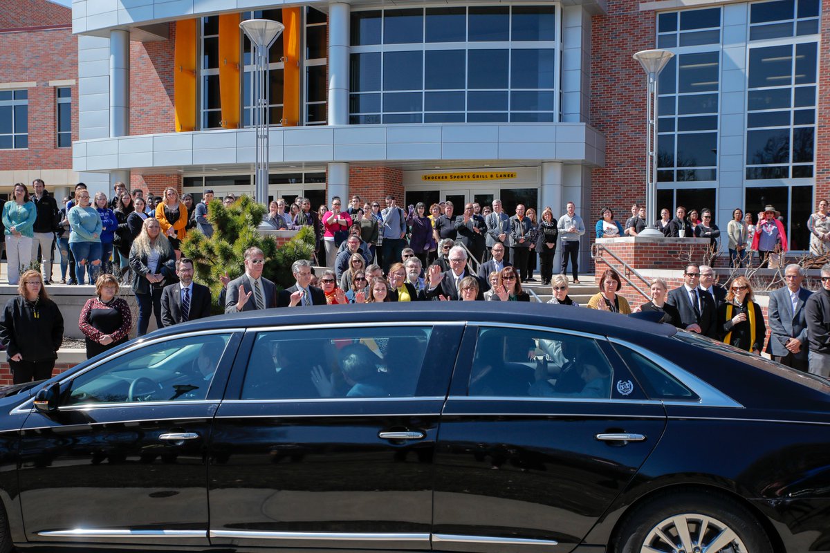 jtbhaus77's tweet photo. At 11:54 a.m. on March 18, 2019, members of the faculty for Wichita State, including Rick Muma (Provost) and Teri Hall (Vice President of Student Affairs), wave to the Bardo family as they pass by the Rhatigan Student Center. https://t.co/cAEADPPGmZ