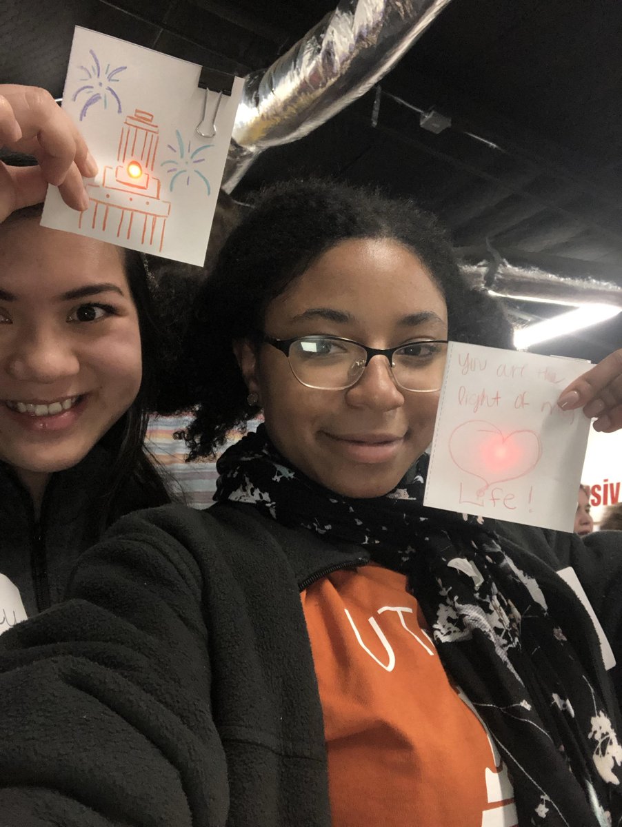 UTeachMaker's tweet image. Today's #MakerMonday highlights the great community that comes with making. Here we have some of our newest makers (Shirley and Erica) helping to celebrate the opening of one of the newest makers spaces in Austin Co.Lab by making some paper circuit cards #UTeachMaker