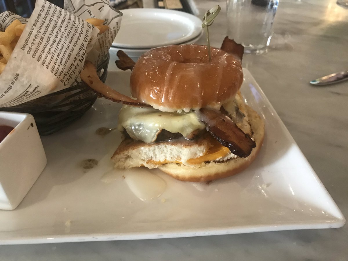 Time2Gtfo's tweet photo. Pound cake and cheese steak? How plain. How about sugar factories bacon cheeseburger on top of a grilled cheese sandwich stuffed between a glazed donut bun @byKatherineLam @SteveDoocy @ainsleyearhardt @PeteHegseth @foxandfriends @FoxNews @JoesSteaks @SugarFactory https://t.co/1psTjjoKda