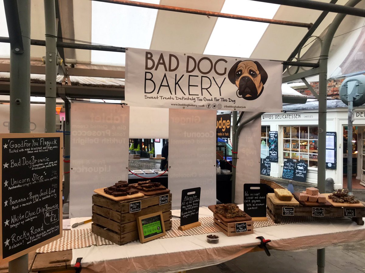 baddogbakeryuk's tweet photo. The droplets falling from the sky aren’t stopping us today - we’re here at @Shambles_Market to make this grey, wet Thursday a little sweeter. Come and see us for #traybakes galore! #baddogbakery #brownies #flapjack #rockyroad #unicornslice https://t.co/jKxIfPNd1q