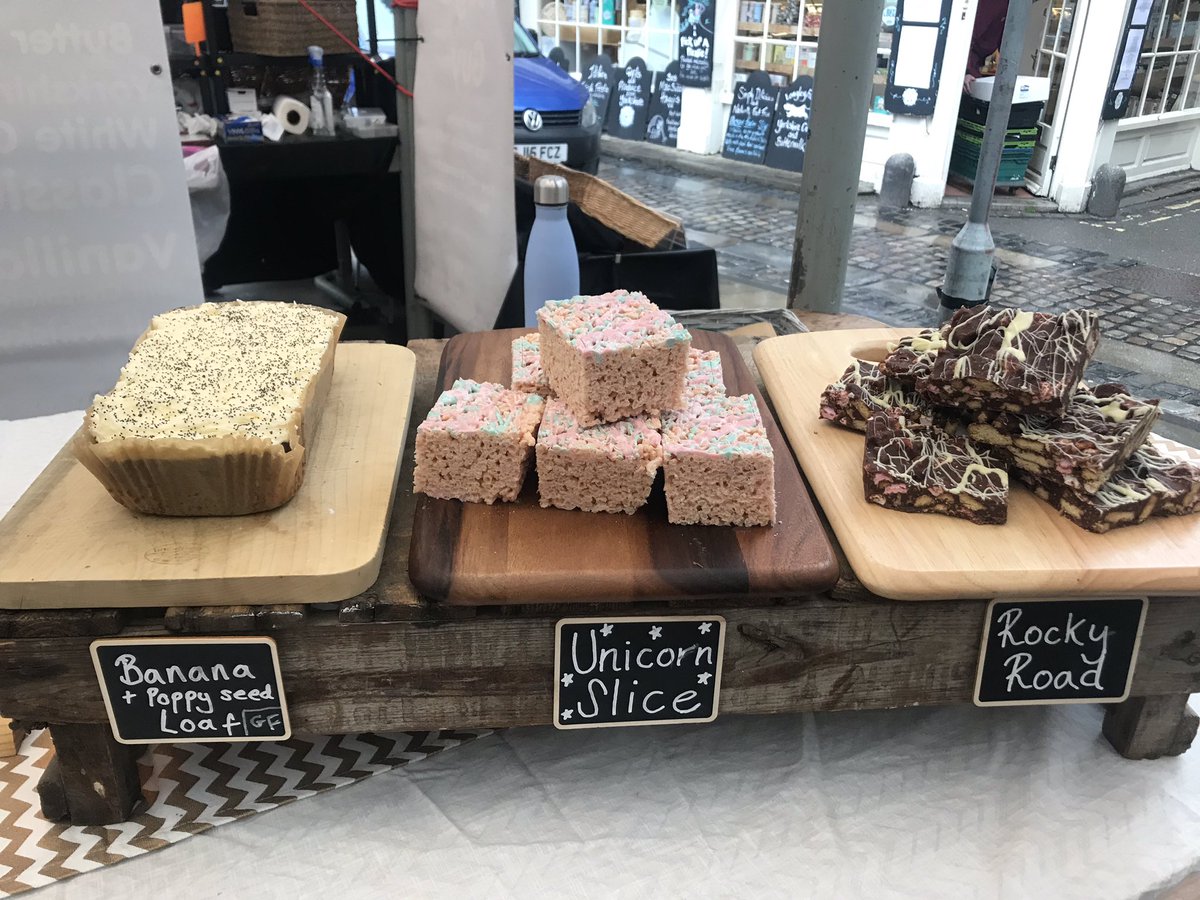 baddogbakeryuk's tweet photo. The droplets falling from the sky aren’t stopping us today - we’re here at @Shambles_Market to make this grey, wet Thursday a little sweeter. Come and see us for #traybakes galore! #baddogbakery #brownies #flapjack #rockyroad #unicornslice https://t.co/jKxIfPNd1q