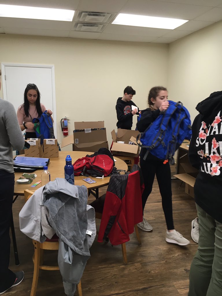 Assembling backpacks for the homeless in our community 🎒🔦 #memorialmakesadifference