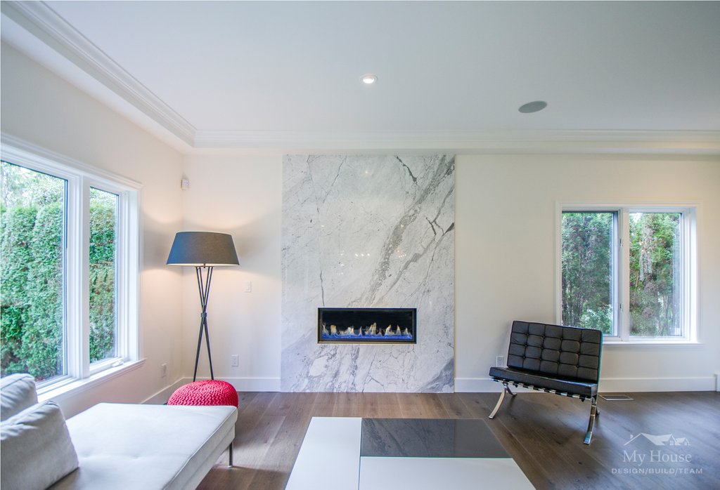 A sleek and modern fireplace can change the entire feel of a room ⁣🔥⁣

#WestVancouver #WestVan #NorthShore #livingroom #familyroom #fireplace #modernfireplace #stoneslab #stonefireplace #modernfurniture #interiordesign