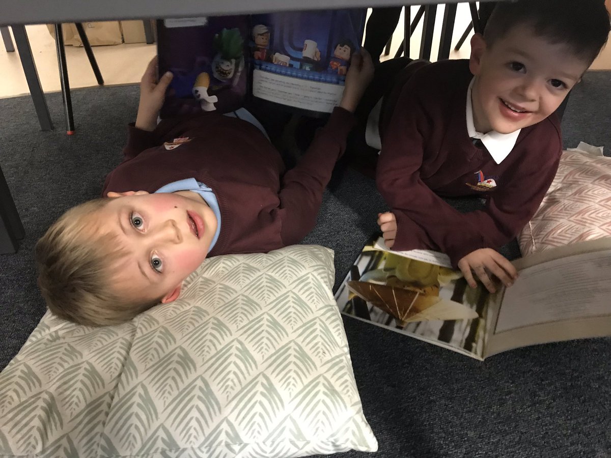 's tweet image. P2 @stdavidsprimary enjoyed reading their favourite books today!  We found some comfy and exciting places to read with our friends! #ReadingRocket #LoveOfReading #WorldBookDay2019