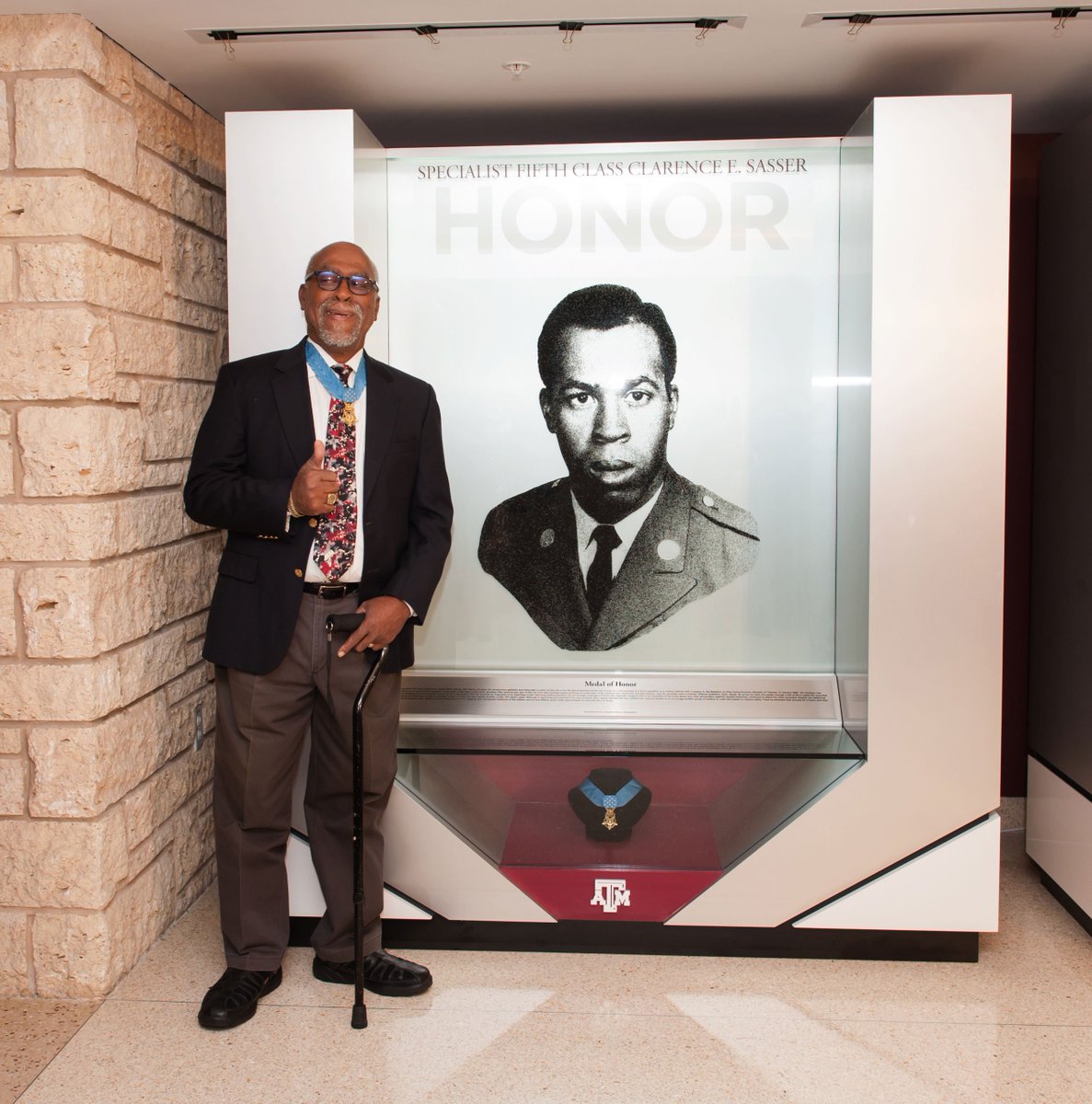 Clarence Sasser standing next to his mural in the MSC