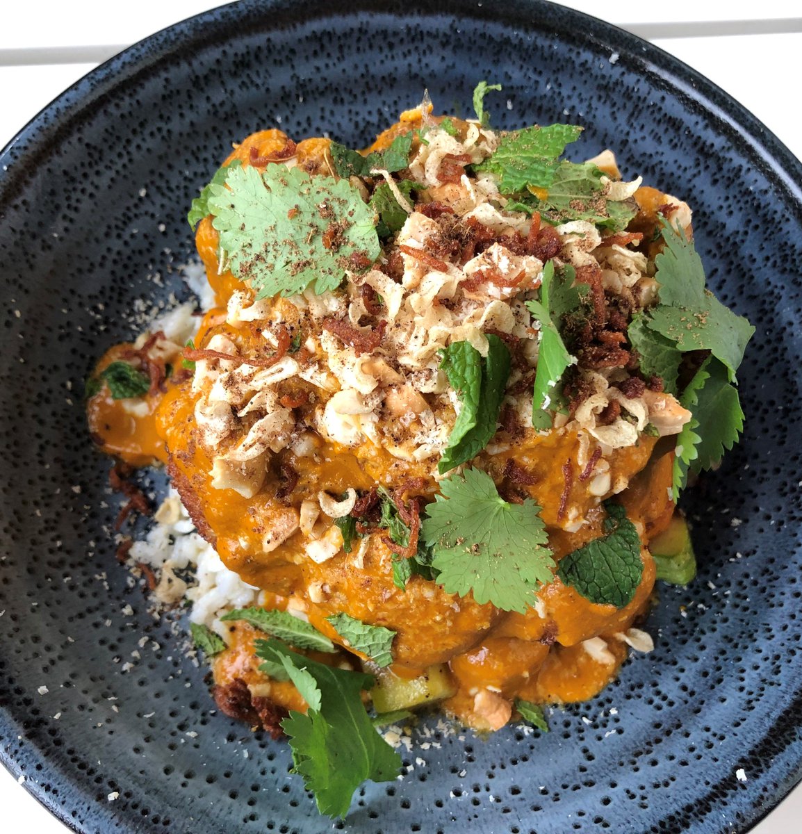 Our new Cauliflower Korma, made with cashews, chili oil crispy shallots, garlic, and Carolina Gold Rice is a must-try. #dinealysbeach #calizarestaurant