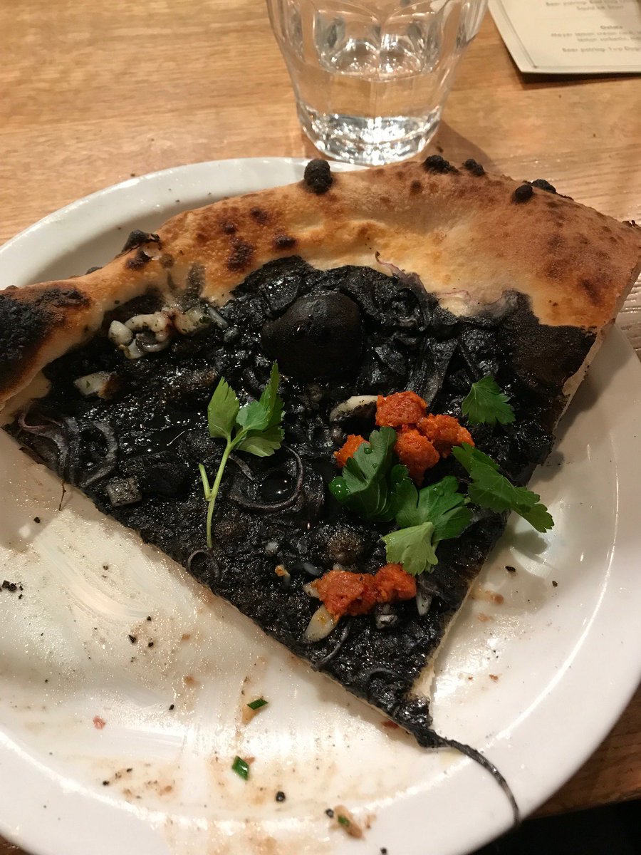 SLWinter3's tweet photo. Yes, I ate this at Victoria's Beer Week, Beer &amp; Pizza &amp; Gelato night! It was actually really good, despite looking like asphalt. Showed the pic to my mom. Her witty comment: it is dark. Ya don't say... #squidink #squid #YYJ #Victoriabeerweek #pizza #PizzaPrimastrada #tasty #yum https://t.co/8jDHqbUl79