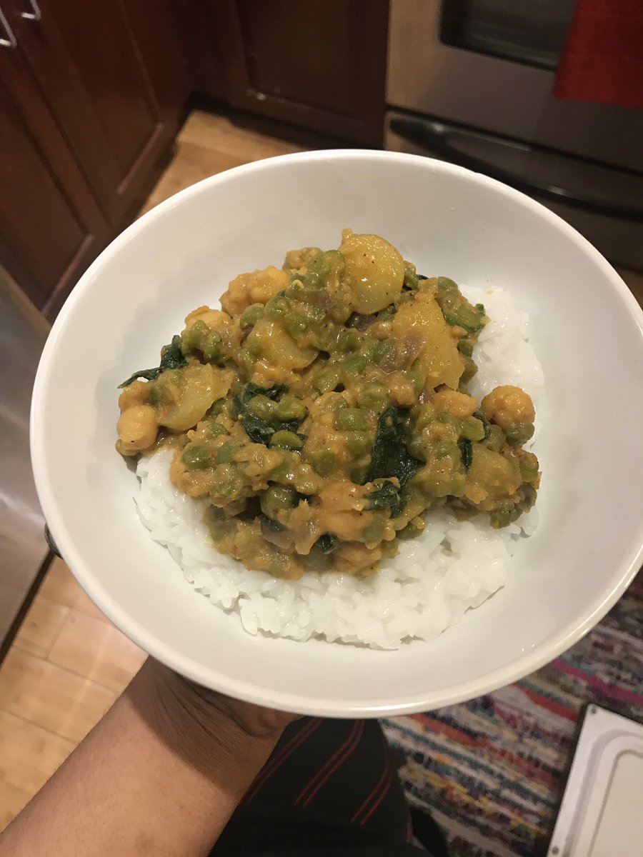 Curry for dinner tonight made with split green peas, chickpeas, onions, potatoes, spinach and carrots 