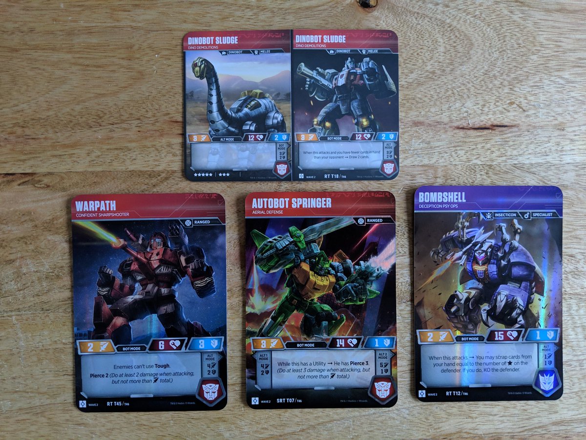 GeeksValhalla's tweet photo. #TransformersTCG wave 2 Rise of the Combiners is out and we got a booster box. We had some pretty decent pulls. Not sure how I feel about the foldable cards and how they will hold up. #transformers #riseofthecombiners #wizardsofthecoast #hasbro #morethanmeetstheeye https://t.co/HNMvukCaym