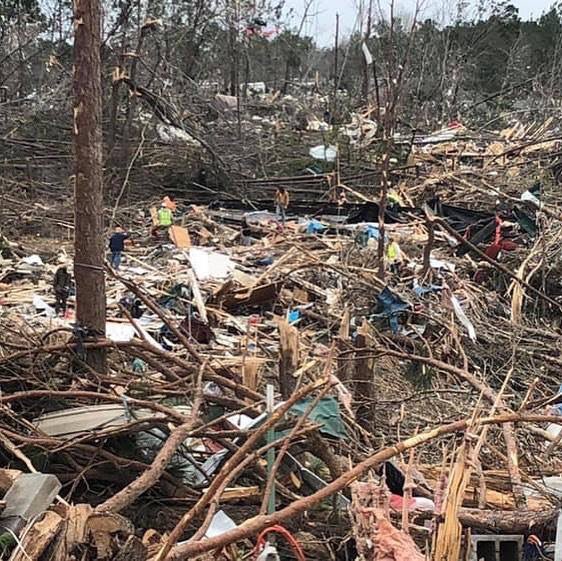 2016CajunNavy's tweet photo. This photo really puts the devastation and scale of what we have been searching through into perspective. Look at how small the people look in comparison to the debris field. It’s like trying to find a needle in a haystack. So so very sad. #cajunnavy #cajunnavy2016 #LeeCounty https://t.co/ptcVuyys3t