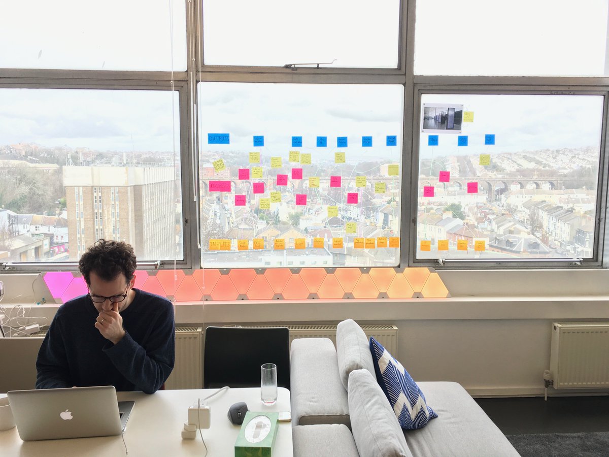 Neil Hawkins deep in thought with the Brighton skyline behind him