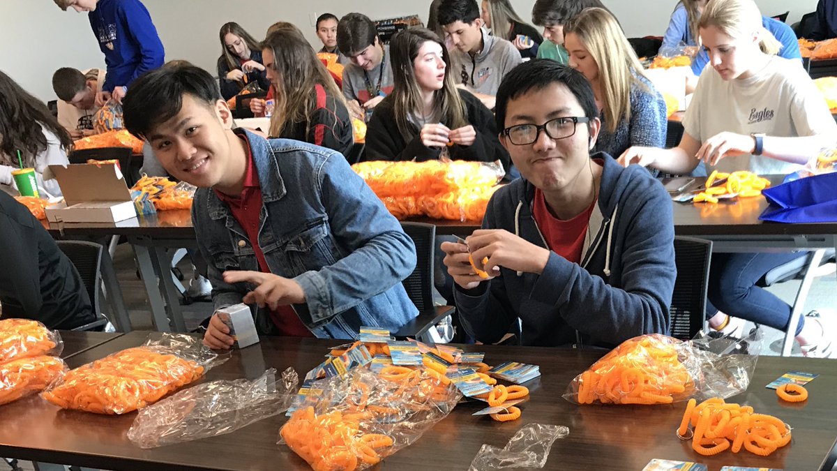 LCCSEagles's tweet photo. Will the Sophomores beat the Junior/Senior record from yesterday of 25,500 bands? They’re assembling Water Watcher tag  bags, in coalition with Cook Children’s Hospital. #lccseagles #missiondays https://t.co/GmyekqP7fm