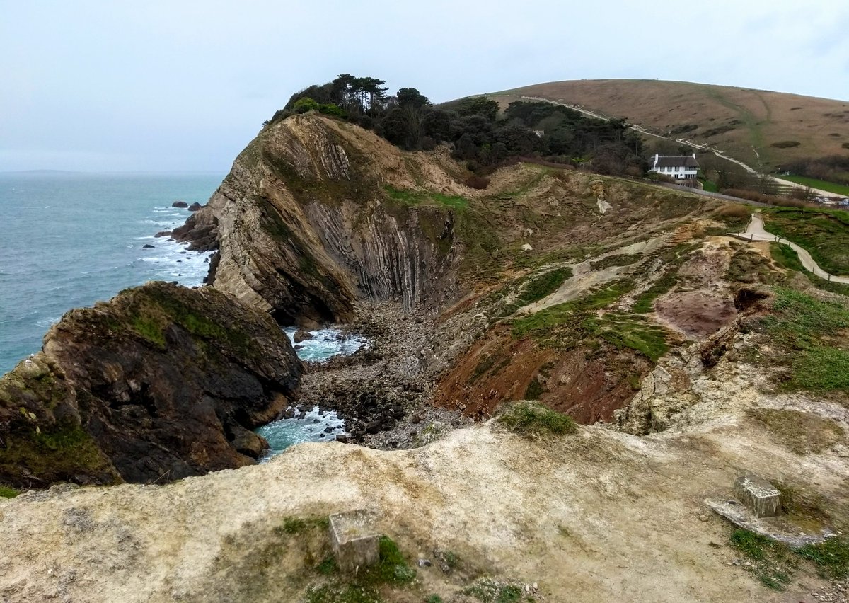 Caroline_Clason's tweet photo. A bit too damp for climbing today, but a nice day for a visit to Lulworth Cove to geek out on geology and some cool beach finds! 🌧🐚 #notclimbing #FossilFriday #getoutside #longweekend https://t.co/n45bH19PzJ