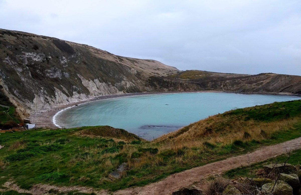 Caroline_Clason's tweet photo. A bit too damp for climbing today, but a nice day for a visit to Lulworth Cove to geek out on geology and some cool beach finds! 🌧🐚 #notclimbing #FossilFriday #getoutside #longweekend https://t.co/n45bH19PzJ