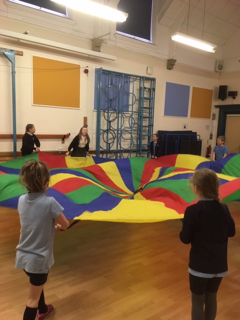 PEHolyTrinity's tweet photo. There was great excitement at our Moving Mondays (Change 4 Life) Club this week when the parachute made an appearance! #ActiveTrinity #Inclusive #LearnToLead https://t.co/pcmAd2zTae