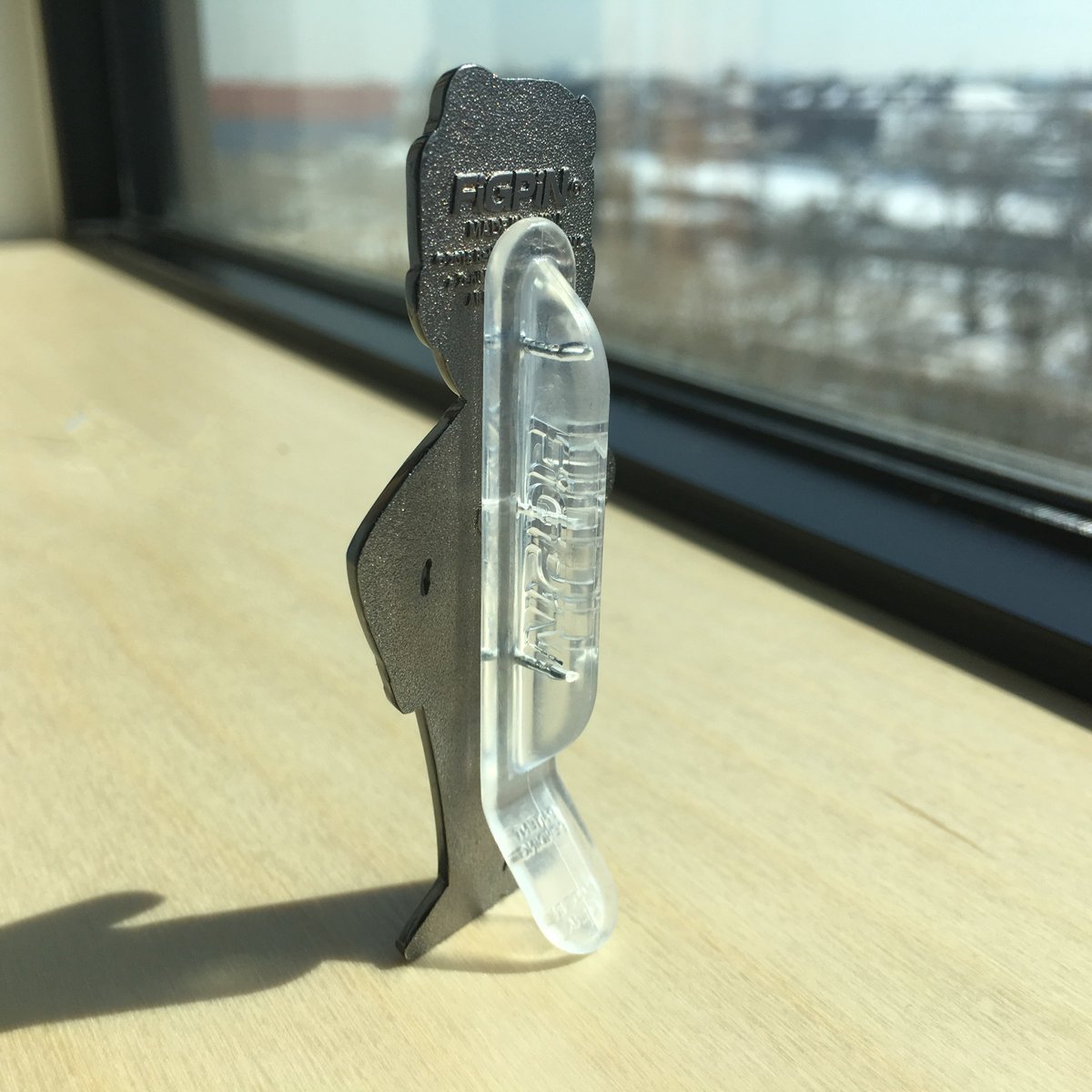 Unique pin-back design that allows the FiGPiN to be displayed upright when not being worn.