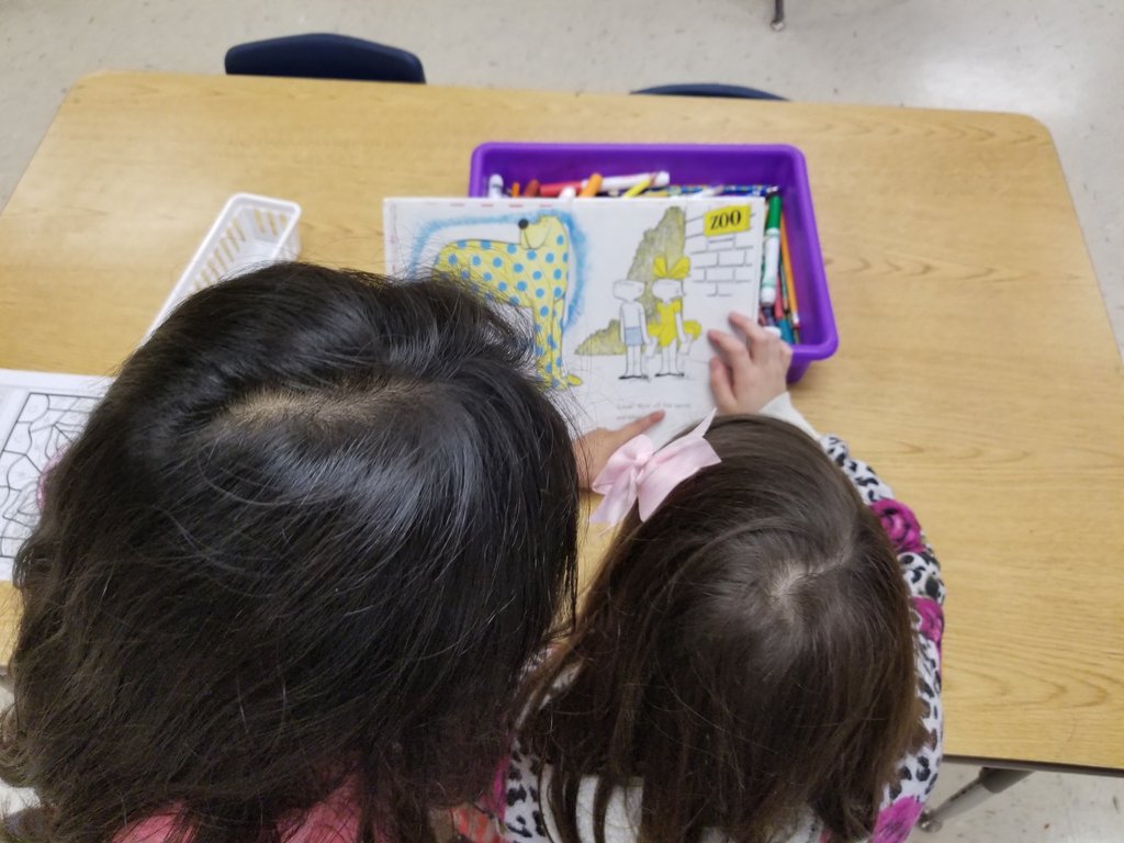 DZ_kinder's tweet photo. These girls were partner reading "Put Me in the Zoo" to get closer to our goal of reading 500 books and turning Mr. Colunga into an ice cream sundae. 

😃 We have surpassed that goal, but the kids enjoy logging the titles of the books they read. Why not just keep going? 🤷🏻‍♀️❤📖 https://t.co/gbDeAnMxEs