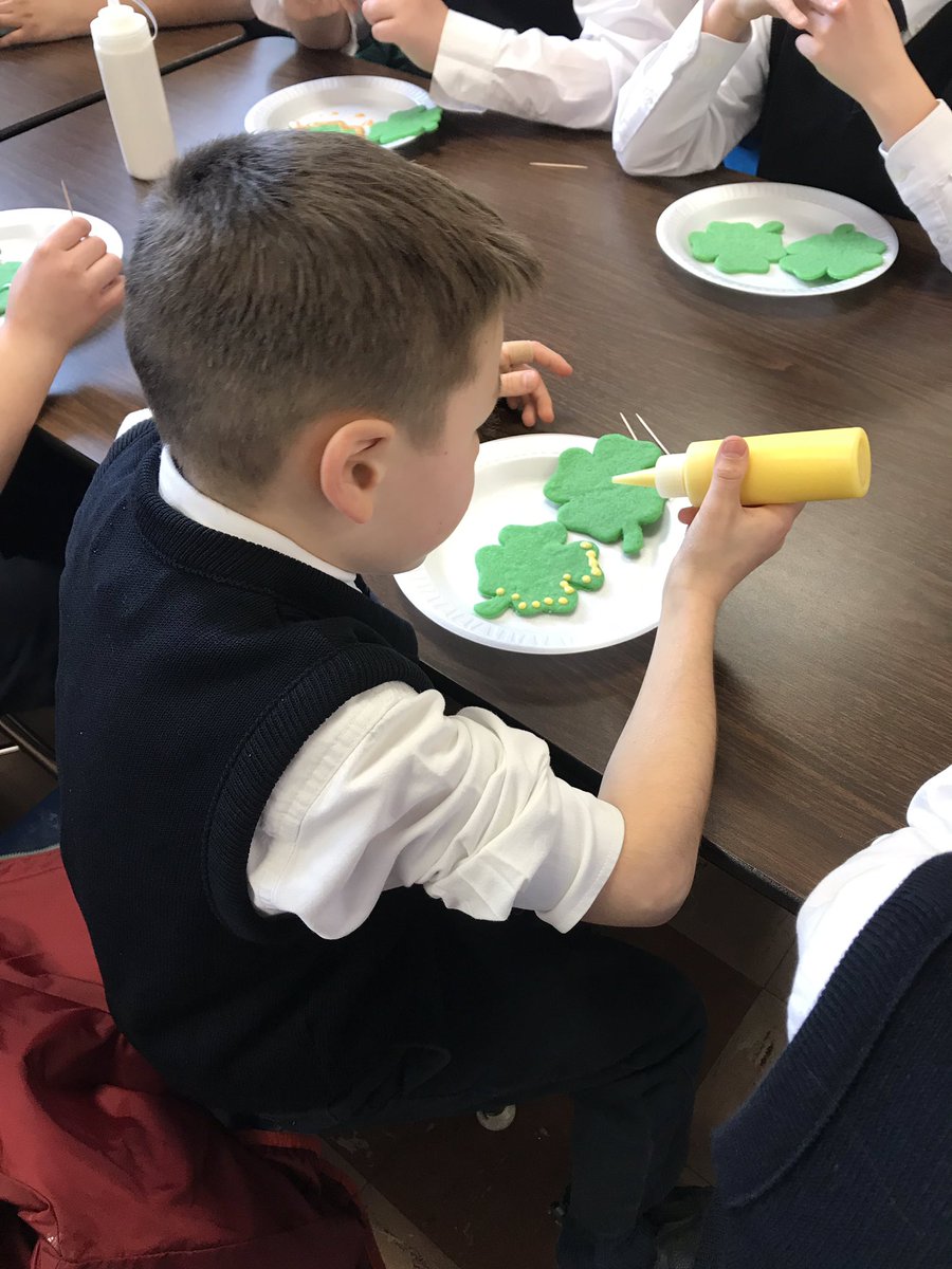 MsLaufenberg's tweet photo. A surprise cookie decorating for the SJS students! 5th grade had a blast! #saintjeromeschool #sjs #StPatricksDay https://t.co/nStHrIhkY3