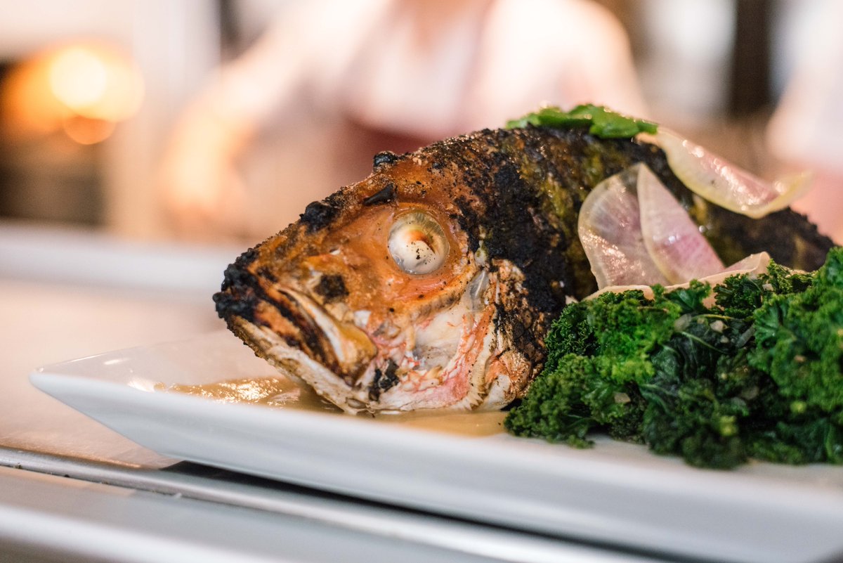 Whole wood roasted fish, cooked in the josper [a combination of a charcoal grill &amp; an oven, which lends an ethreal char]. It's finished off with steamed garlic &amp; bright, sautéed greens for maximum flavor.
#ColtivareHouston #AgricoleHospitality