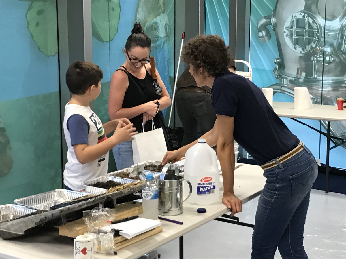 NQDRYTROPICS's tweet photo. Awesome turn out at The Soil Science Australia stand at Street Science - Museum of Tropical Queensland. Young & old learning lots! @NQDRYTROPICS staff & Jim from @SoilScienceAust kept busy. Come on down & say hello! #SoilScienceAu #WSFTownsville https://t.co/9JH1ojVaSG