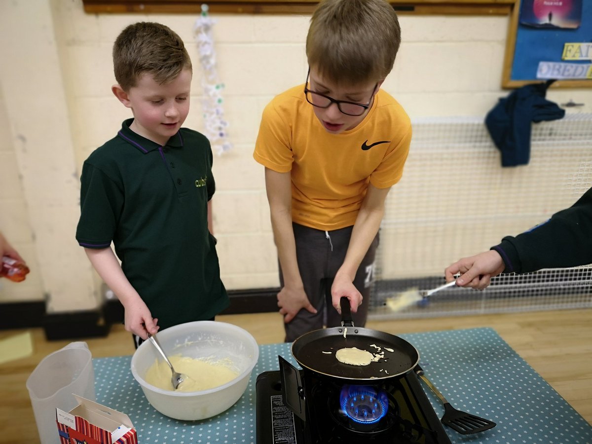 Scout teaching Cub. Cub later shows scout how it should be done