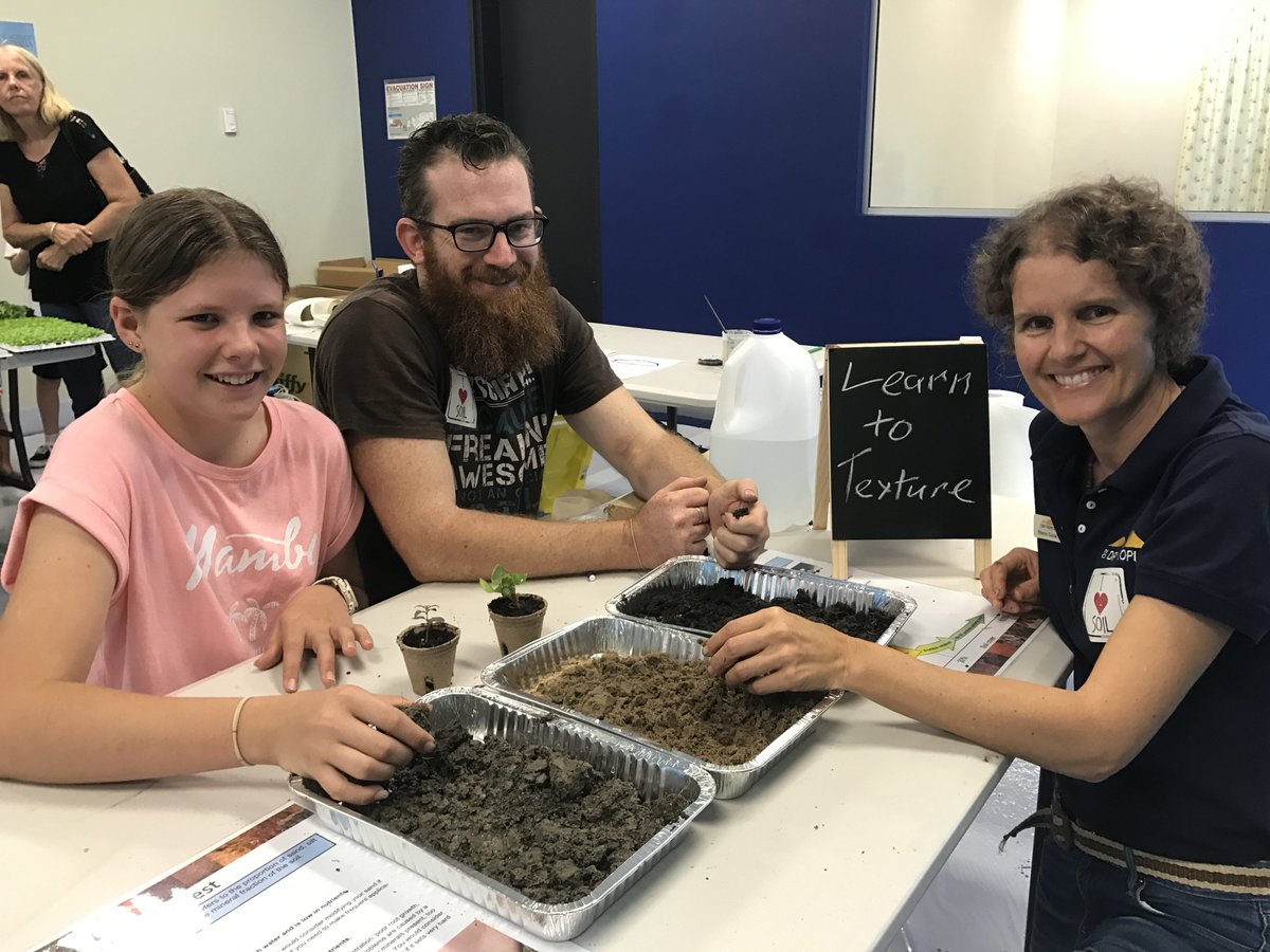 NQDRYTROPICS's tweet photo. Great fun at Street Science - Museum of Tropical Queensland. @NQDRYTROPICS & @SoilScienceAust blown away by people's interest in soils #soilhealth Everyone potted a seedling to take home. Even painted with soil! #SoilScienceAu #WSFTownsville @NRMRegions https://t.co/nDEBSAwKS3