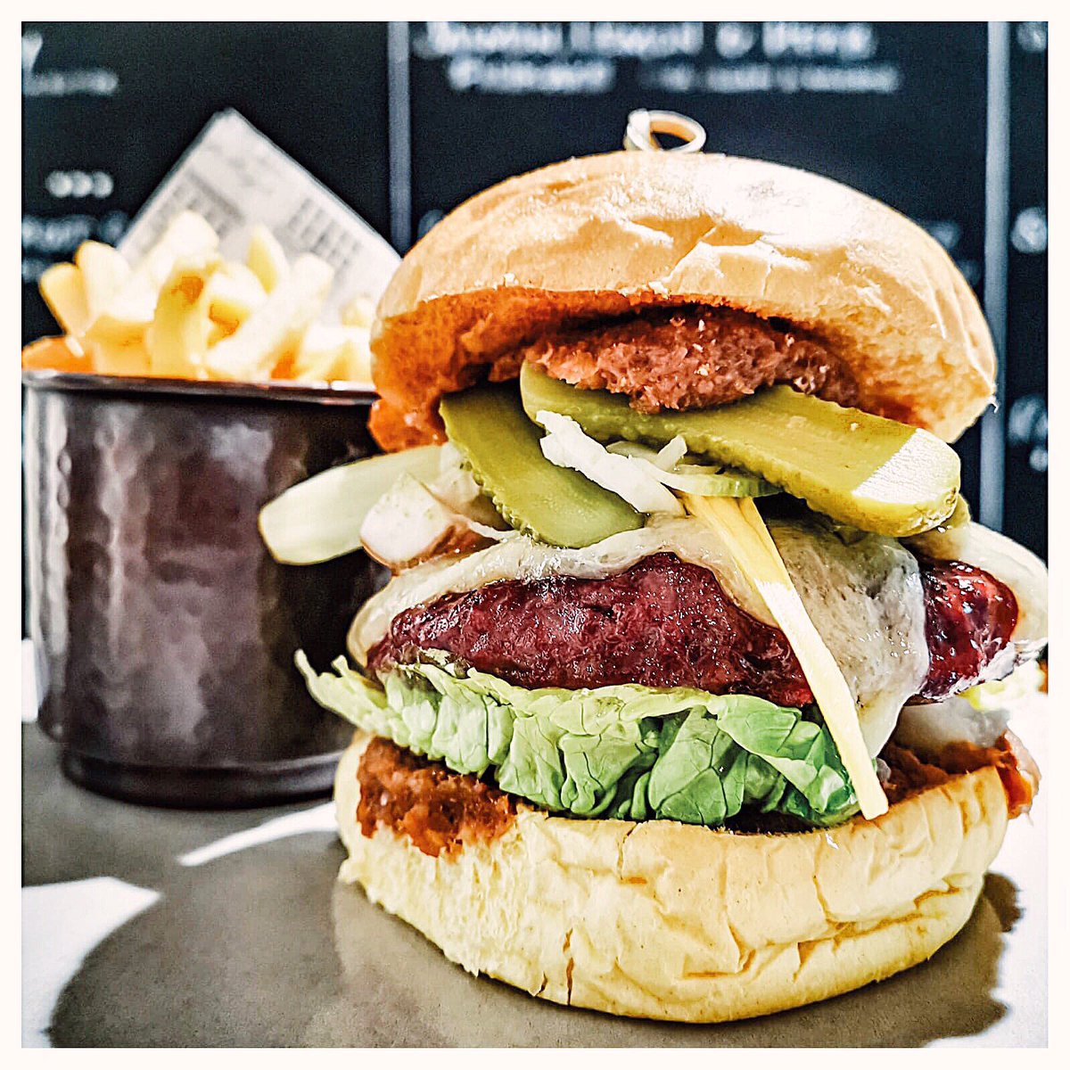 CafeRoyalNE's tweet photo. Who else is having a #cheatday this weekend? Our succulent beef #burger is accompanied by bacon jam, roasted tomatoes, homemade house pickles, Lincolnshire poacher cheese and served in a toasted brioche bun with a healthy serving of crispy french fries on the side.#NEFollowers https://t.co/QBQQ6G18BB
