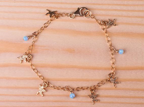 spiralshan's tweet image. Gold charms bracelet, angels charms and opalite #jewelry #bracelet @EtsyMktgTool etsy.me/2CBteNL #angelcharms #babyangel