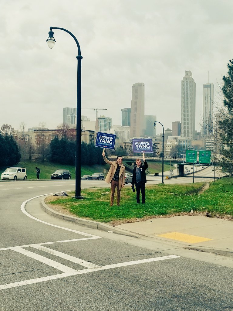LaceyDelayne's tweet photo. Atlanta #YangGang holding up signs at a busy intersection in the A this morning! Spreading the word about @AndrewYangVFA! #Yang2020 https://t.co/3Lf8aLMVac