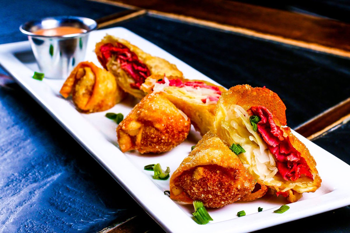 HopCatMPLS's tweet photo. One weekend only (Fri 3/15 - Sun 3/17) we’ll be serving up our Reuben Rolls for #StPatricksDay — corned beef, sauerkraut &amp; Swiss cheese wrapped in an egg roll, fried golden &amp; served with 1000 Island dressing. https://t.co/3sKZWF6twP
