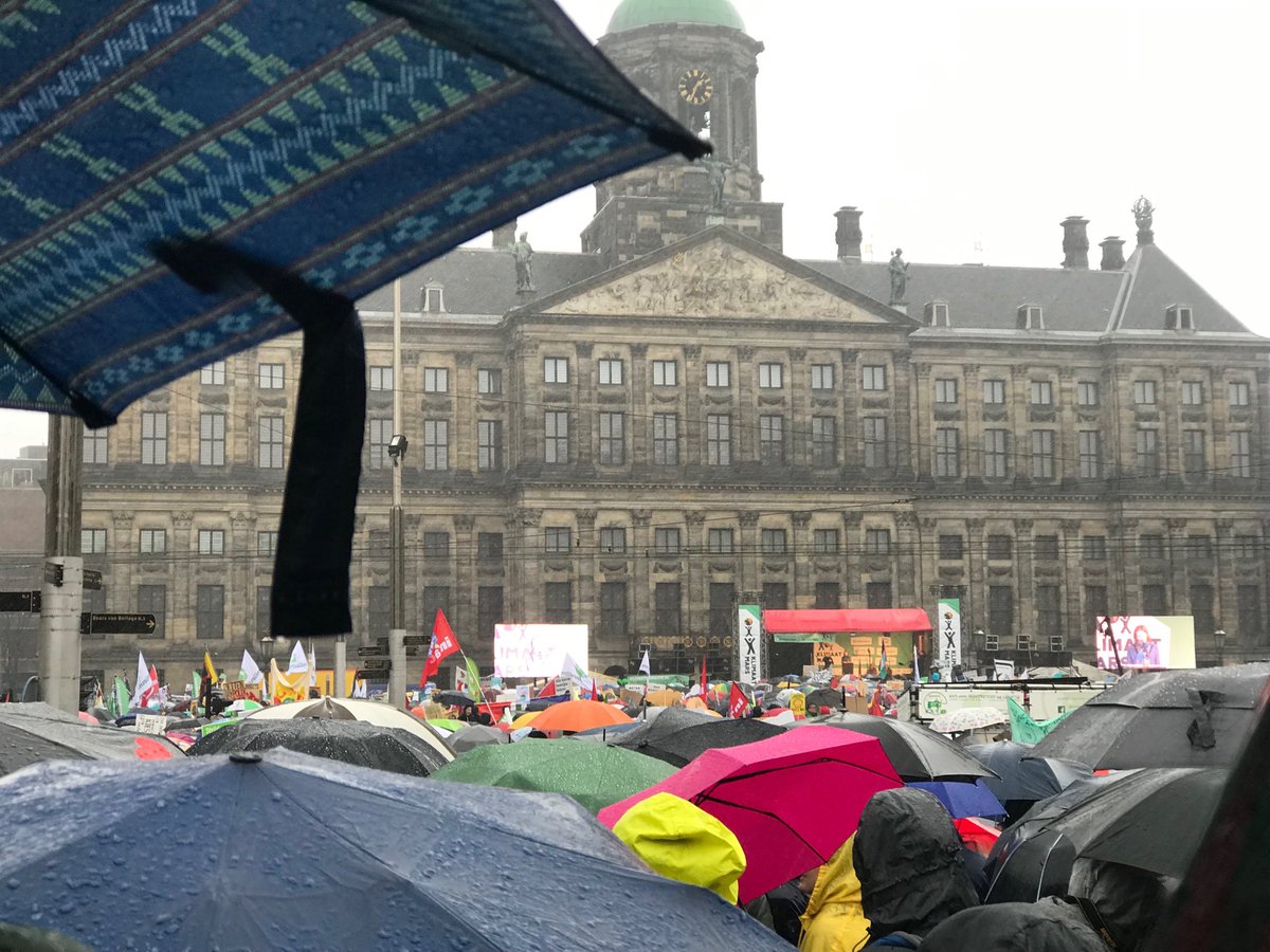 mkvaalst's tweet photo. Great to be weathering the rainy #klimaatmars in good company of tens of thousands of great people incl @RCClimate @rodekruis colleagues Fleur &amp; ⁦@SHogesteeger⁩, and family ⁦@corinnetutein⁩ &amp;  Roebijn (her second big climate march in one month!) ⁦@PfRglobal⁩ https://t.co/9gkeuCoiAY