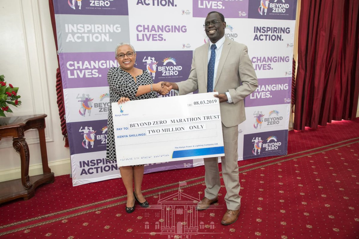 KenyaPower's tweet photo. Ag. MD & CEO Eng. Jared Othieno presents a dummy cheque of kshs. 2M to the first Lady Her excellency Mrs. Margaret Kenyatta, a sponsorship towards #BeyondZeroCampaign #BeyondZeroKenya #BeyondZeroHalfMarathon2019 EN https://t.co/nw5Ln26eML