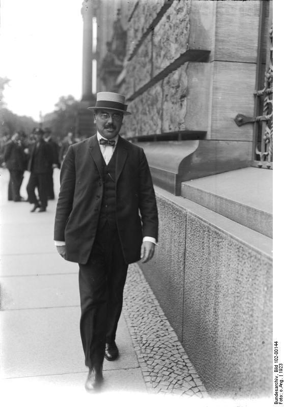 34a\\ In the early 1920s, Hilferding moved to Schiffbauerdamm 26. Today the site houses a building of the German Bundestag. Hilferding himself was an MP from 1924 until 1933, serving as Finance Minister in 1923 and again from 1928 until 1929. (Thanks to  @JohaThens)