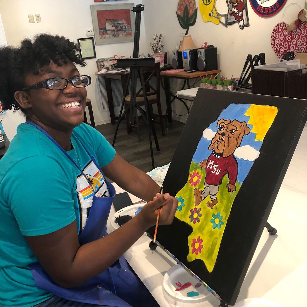 MaroonVolunteer's tweet image. Day 1 of the MS Delta Alternative Spring Break. The trip started with a visit to Robert Johnson’s grave at Little Zion Church, next the historic Bryant’s Grocery, where they reflected on the story of Emmett Till. Later, we had fun at Painting with Friends in Greenwood. #msdelta