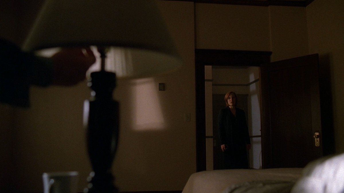 "He fumbles for the light, as Scully appears in the frame of the door, several steps back. Noncommittal.""Padgett straightens, pulls the sheet on the window haphazardly aside, just as we saw it pulled aside in his fantasy." #XFScriptWatch  #Milagro