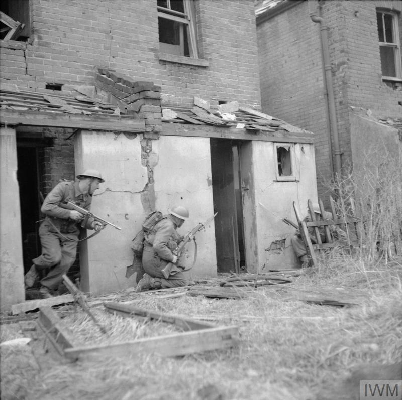 There's one other picture on the IWM website taken on the same day, also showing 47 Infantry Division at a Battle School "in Lymington", this time using bombed out houses for training.  https://www.iwm.org.uk/collections/item/object/205198272