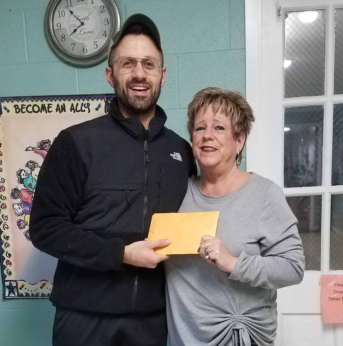 DoveInc_IL's tweet photo. Justin Moniz, Chair of @MillikinU  Vocal Studies, as well as an award-winning singer, actor and stage director, presented Teri Ducy the proceeds from their February fundraiser, "Can't Help Falling in Love."  More than $800 was shared for the Domestic Violence Program.  Thanks! https://t.co/zwDVWoJjlo