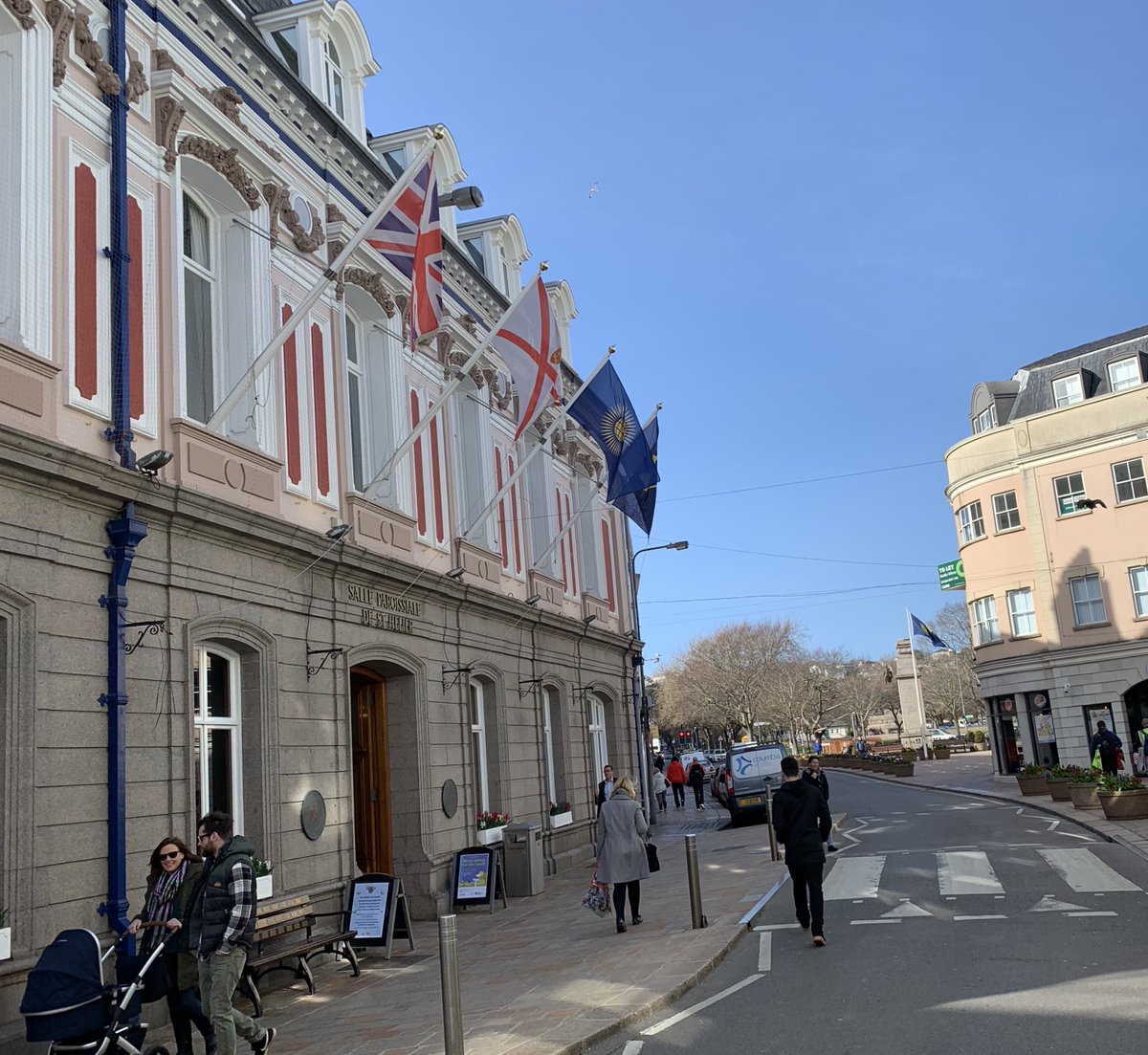 Commonwealth Day flags flying from @StHelierJsy Town Hall and the Cenotaph in the distance following today's ceremony #CommonweathDay