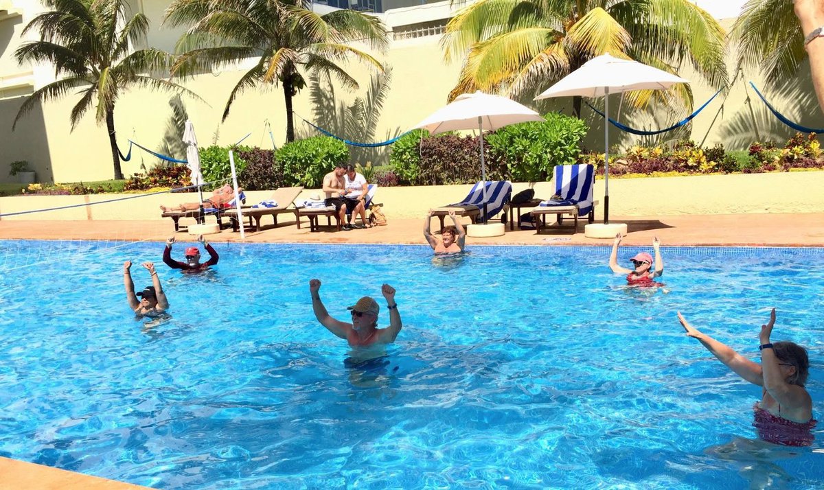 RaintreeClub's tweet photo. Raise your hands if you're having a great Monday! 
Pool workout is better at #ClubRegina #Cancun! https://t.co/UIY25Gte1G