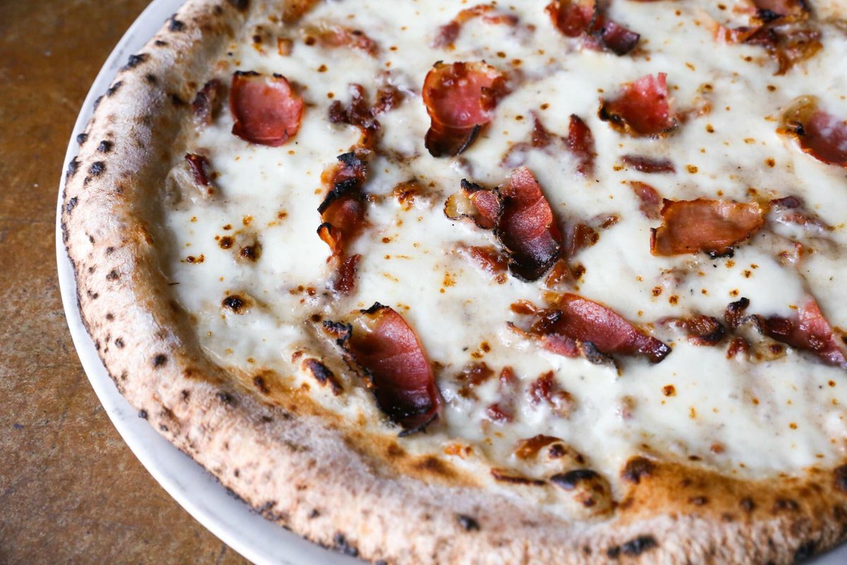 More amazing than the time you ate your weight in Cane Rosso pizza? #truffleshuffle 🍕

Housemade mozzarella, truffle cream sauce, speck ham, and bacon...available all March long at Cane Rosso!!