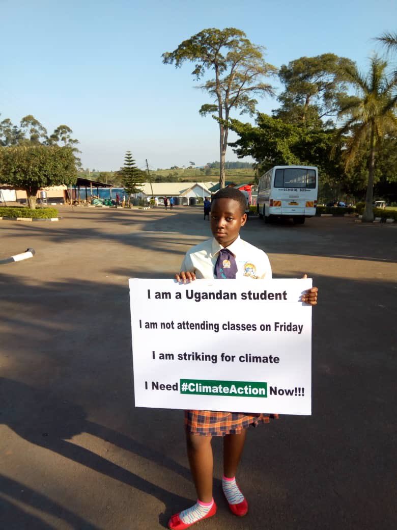 FutureCoalition's tweet photo. This is a global movement! 14-year-old climate change activist @NamugerwaLeah is striking in Kampala on Friday.

Where in the world are YOU striking? Take a photo with a sign detailing where &amp; why you're striking and then share it using #YouthClimateStrike!

📷: @NamugerwaLeah https://t.co/wTKZGgtADl