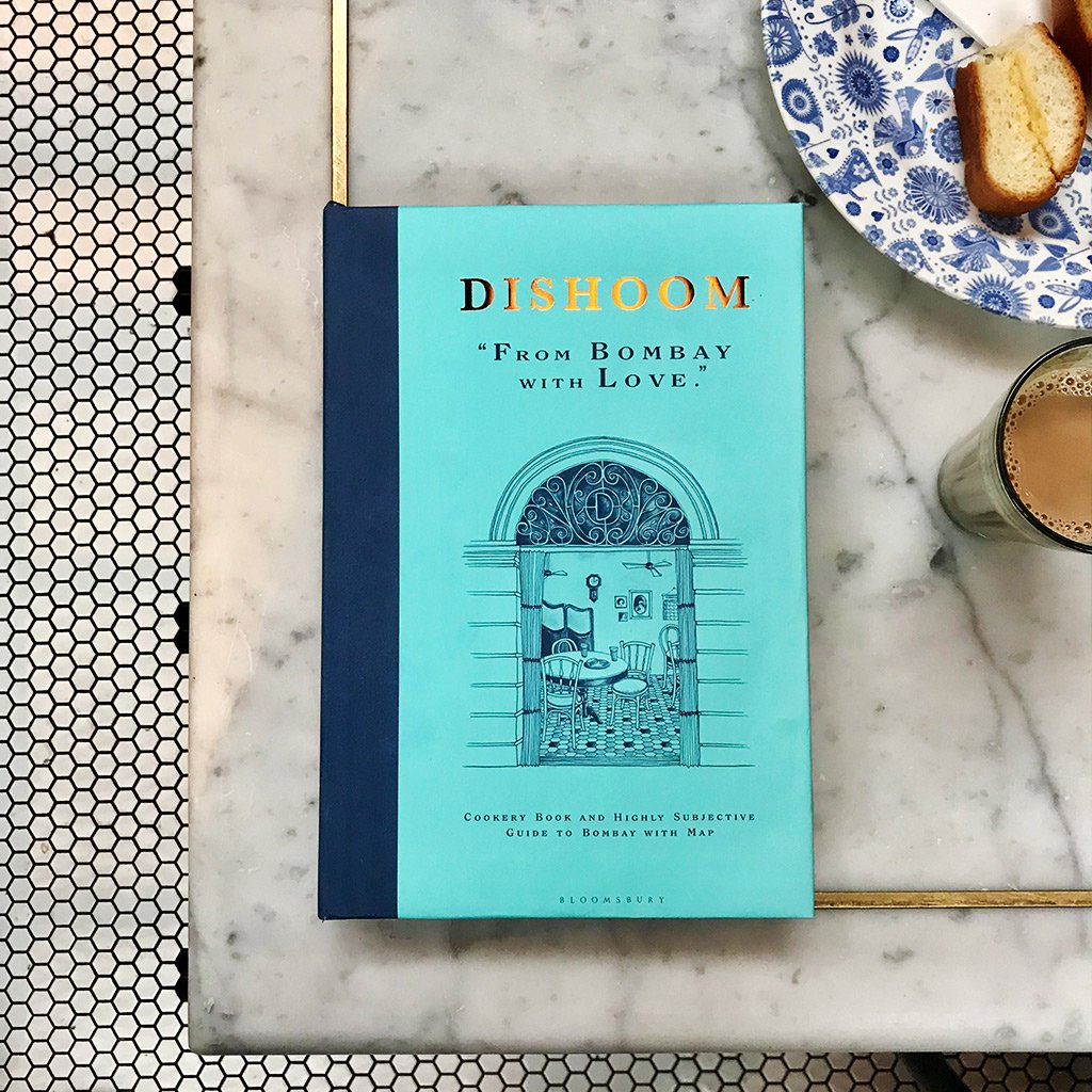Dishoom's tweet photo. Delighted to see and hold our first (strictly unofficial) copy of Dishoom: From Bombay with Love, our cookery book and (highly subjective) guide to Bombay. It’s published on 5th September 2019, and available to pre-order now on https://t.co/F071ImdtOg. https://t.co/0Cc35wJMx5