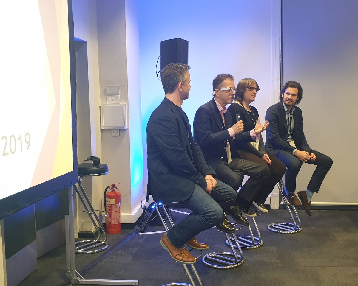 GioKinto's tweet photo. 'Industry 4.0 – AR/VR in business' panel featuring James Watson (Immerse), Julien Develle (Xpert Eye), Indira Knight (Royal College of Arts) and Husamettin Bayarzit (HUBA). Discussing what impact AR/VR is having in enterprise #WTS2019 #AVR360 https://t.co/g77vvFGLeS