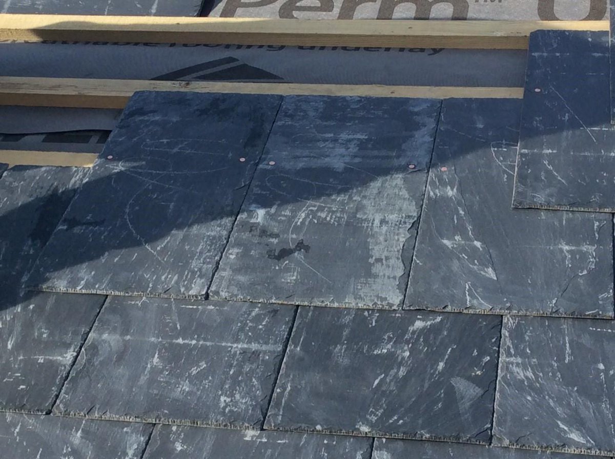 This photo captures new slates being fixed with copper nails on the roof of an old Railway Station in rural Leicestershire. Planning a similar project to a historic or listed building? contact us to see how we can help you find Building Control compliant solutions #compliance