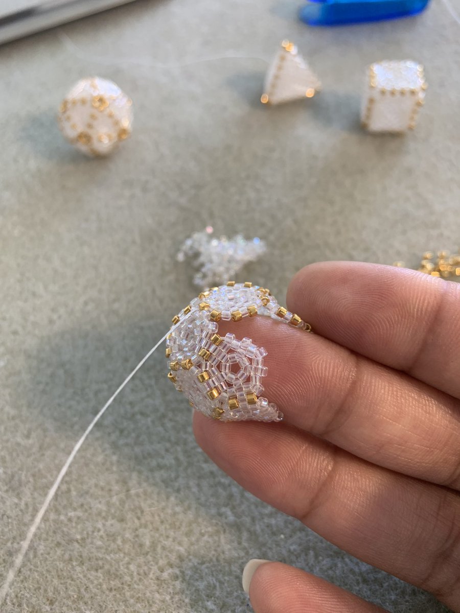 SunDropsStudio's tweet image. #Processshot: Stitching up a tiny #dodecahedron. This little guy gave me a lot of trouble today. If it’s smaller it’s harder. And it’s double trouble with transparent beads, nowhere to hide.  #funtimes😎 #mathart #crystal and #24kgold #miyuki #seedbeads #glassbeads #beadstitching