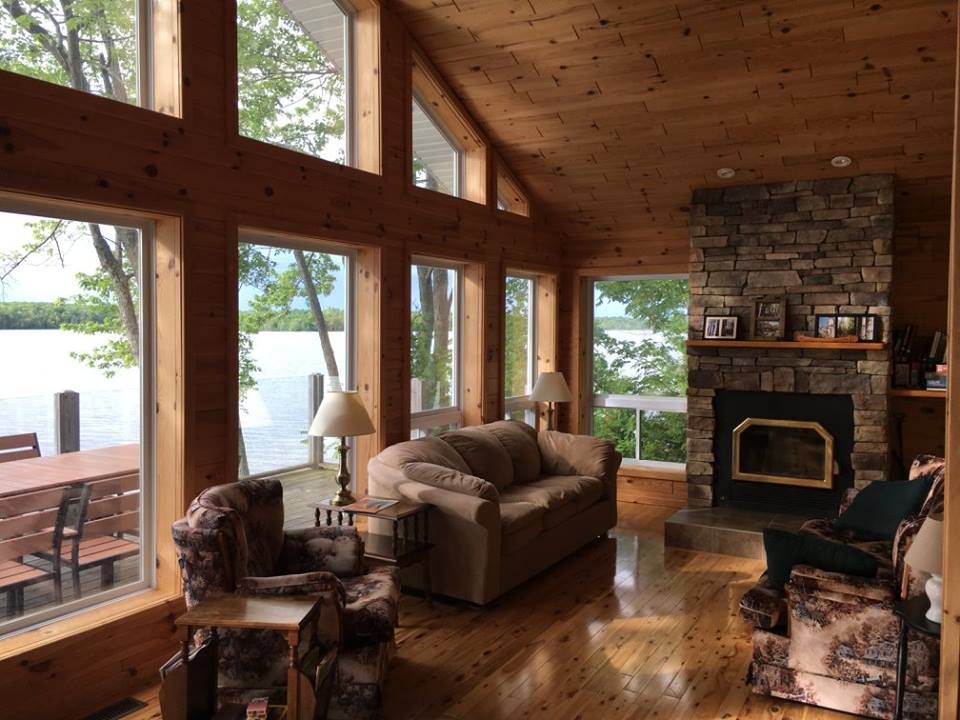 RentLoonLodge's tweet photo. A wall of windows and plenty of seating for enjoying the waterfront views, no matter what the weather! millerlakerental@gmail.com #brucepeninsula #hikethebruce #cottagesincanada #exploreontario #ontariocottages #brucetrail https://t.co/ShrYEUjMrE