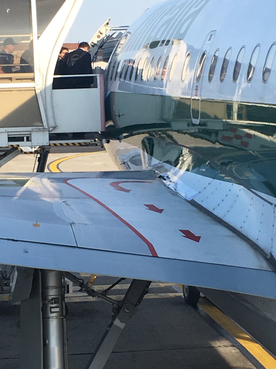 deltagarrett's tweet photo. @Alitalia , while on-boarding on the AZ0112 flight from LIN-AMS I noticed the duct tape on the wing plus a wide gash on it (photo attached). I asked the crew for details, but I was told "we know nothing". Is there any rational explanation to fly an airplane in these conditions? https://t.co/sTT2MLDGPa
